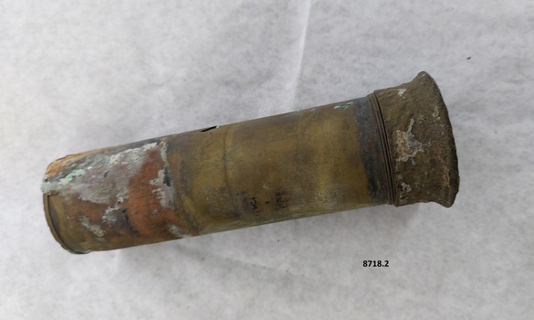 Cylindrical brass tube with slightly flared cap at one end.
