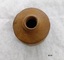 Top view of clay inkpot showing small round opening and round shoulders.