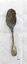 Front of dessert spoon, with fiddle back handle. Has green and black tarnish and the bowl is heavily encrusted.