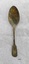 Spoon with fiddle back design on both ends of handle and has brown and some green oxidation.