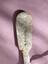 Five vertical hallmarks on back of spoon handle including a "WP", "B" and three more.