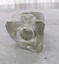 Underneath of a square glass inkwell with concave indentation in base.