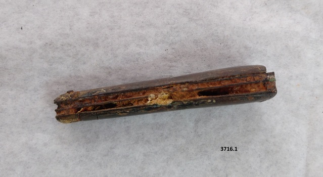 View of blades inside the pocket knife showing extensive corrosion.