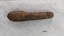 Wooden handle is missing a piece at each end and is stained.