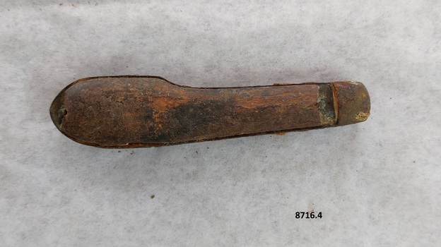 Wooden handle is missing a piece at each end and is stained.