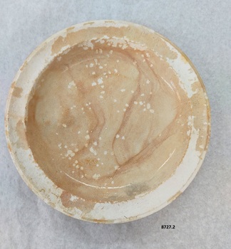 Top of plate 8727.2 showing initial glaze with brown staining and crazing - no chips.
