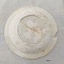View of the underneath of plate 8727.3 showing the missing chip and the blotchy, pitted surface where the glaze is missing.