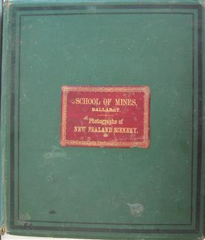 Green covered abum with red leather title