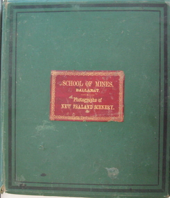 Green covered abum with red leather title