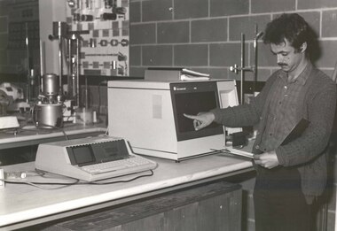 A man uses equipment in a laboratory