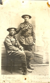 Two Australian soldiers wearing hard helmets