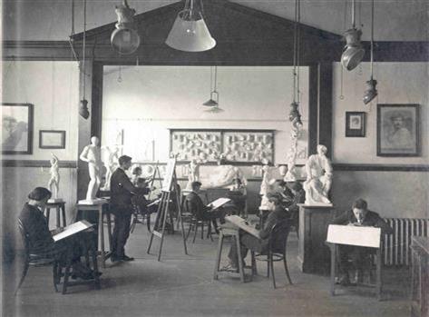 Art school students working at eisels 