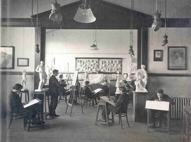 Art school students working at eisels 