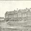 students outside a double storey brick building