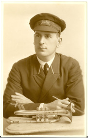 A uniformed man with cornet