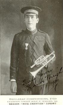 A unformed man in a uniform, holding a cornet