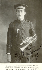 A unformed man in a uniform, holding a cornet