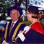 Chancellor David Caro and a mace bearer