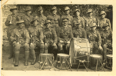 Soldiers in a Bugle band. Drums at the front of the group