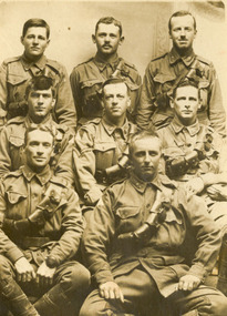 Eight men in Australian Army uniform