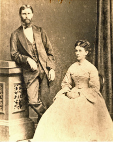 A seated woman and and standing man