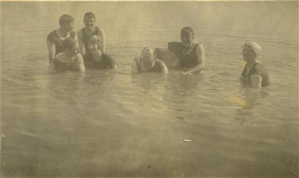 Eight people swimming
