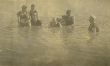 Eight people swimming