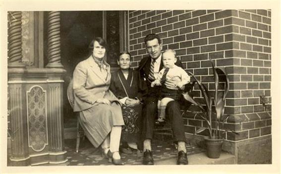 Two women, a man and a todler