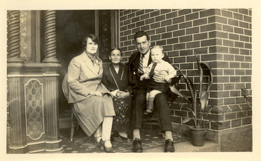 Two women, a man and a todler