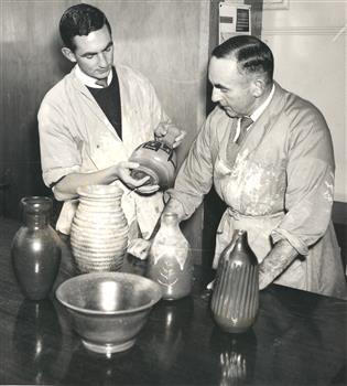 Two men with ceramic vessels