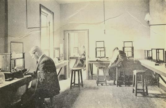 Three men sit in a balance room