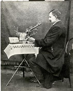 A man at a microscope