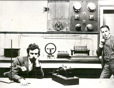 Two men conduct an xray