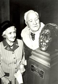 2 people look at a sculpture