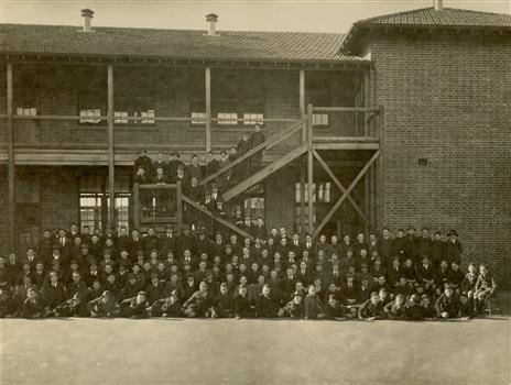 School students outside a double storey school