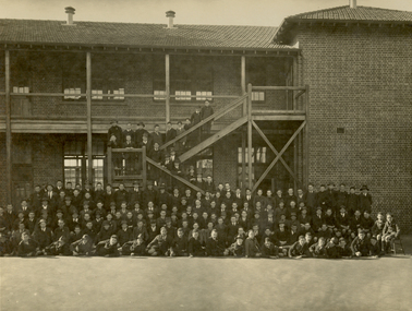 School students outside a double storey school