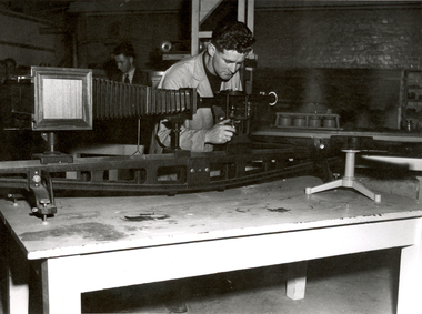 Photograph - Black and White, Jeff Coward with a Reichert Microscope, late 1940s