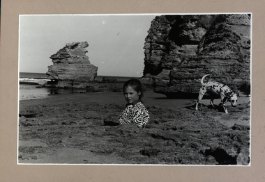 Girl and dog at beach
