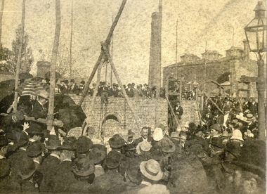 A number of people watch the foundation stone being laid at the Ballarat School of Mines