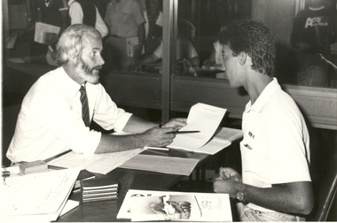 Two men at a desk