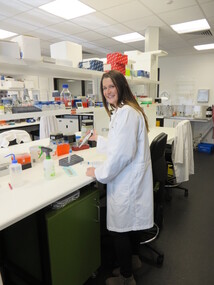 A woman works in a laboratory