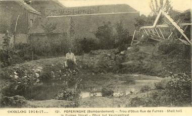 Postcard - black and white, Oorlog (War) 1914-1917  - Poperinghe Bombardment, Shell hole in Furnes Street, c1917