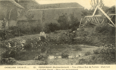 Postcard - black and white, Oorlog (War) 1914-1917  - Poperinghe Bombardment, Shell hole in Furnes Street, c1917, c1917