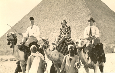 Photograph - Black and White, Frank Wright (right) on a camel in front of a Pyramid, 1940, May 1940