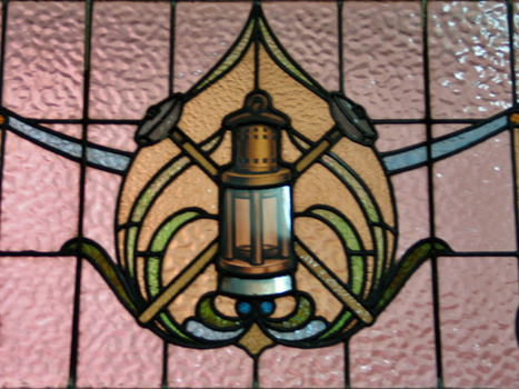 Stained glass represntation of a miners lamp