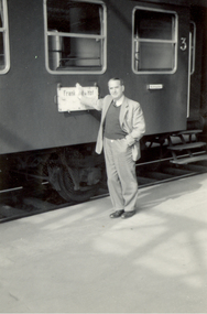 Photograph - Photograph - Black and White, Frank Wright standing beside a train, mid 1900s