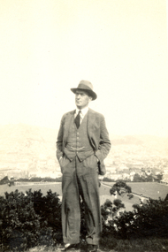 Photograph, Frank Wright overlooks a town, middle 1900's