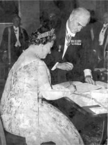 Photograph - Black and White, The Queen Mother signs a book watched by Frank Wright