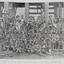 A number of men pose for a photograph outside a mine