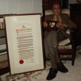 Photograph - Colour, E.J.T. Tippett receives an Illuminated Address from the Ballarat School of Mines, 1984, 18/07/1984